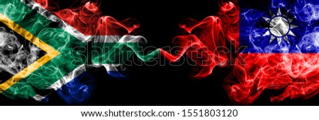 South Africa vs Taiwan, Taiwanese smoky mystic flags placed side by side. Thick colored silky abstract smoke flags concept