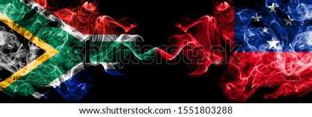 South Africa vs Samoa, Samoan smoky mystic flags placed side by side. Thick colored silky abstract smoke flags concept