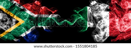 South Africa vs Italy, Italian smoky mystic flags placed side by side. Thick colored silky abstract smoke flags concept