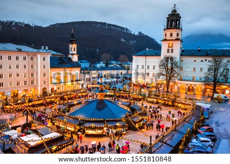 Salzburg, Austria. Christmas market at Cathedral Square, origins of Christkindlmarkt X-mas fair go back to the late 15th century. Royalty-Free Stock Photo #1551810848