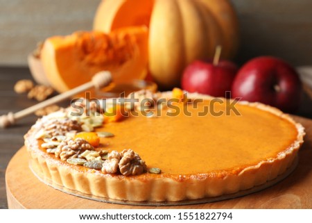 Delicious fresh homemade pumpkin pie on wooden table, closeup