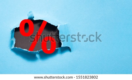 A hole in a blue background with a percent symbol, meaning the sales coming or offers in a shop.