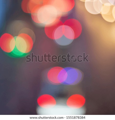 Bokeh of car light at Night time with city tower street light for background.