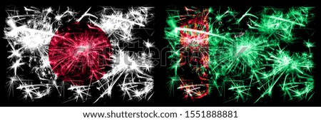 Japan, Japanese vs Turkmenistan, Turkmenistans New Year celebration sparkling fireworks flags concept background. Combination of two abstract states flags.
