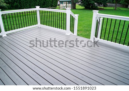 Residential Backyard Gray Composite Deck Royalty-Free Stock Photo #1551891023