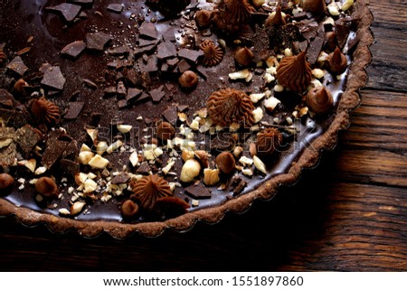 Chocolate tart on wooden background