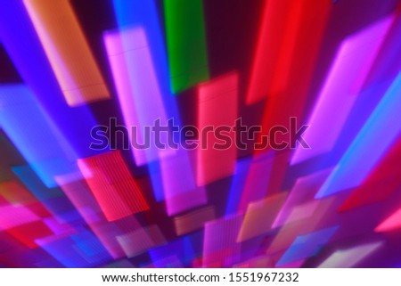 Blurred bright neon lines background. Colourful lights in motion. Abstract background with neon effects, speed theme.
