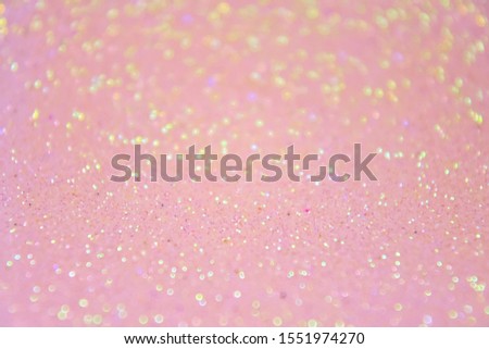 Blurred abstract background with sparkle shiny bokeh. Romantic holiday bokeh background with soft focus and magical shimmering. Christmas and new year card. Pink bokeh backdrop 