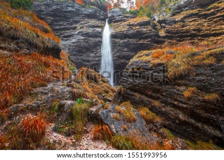 Beautiful Pericnik waterfall in autumn colors on forest in Triglav National Park, Slovenian Alps in Slovenia