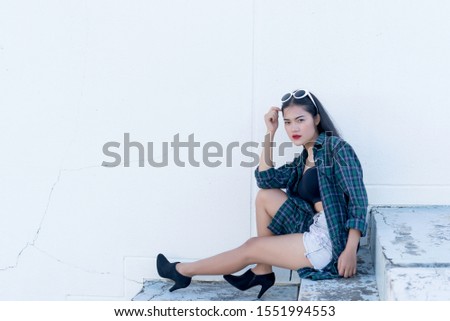 Portrait of beautiful asian woman,Hipsters girl on stair for take a picture,Thailand people