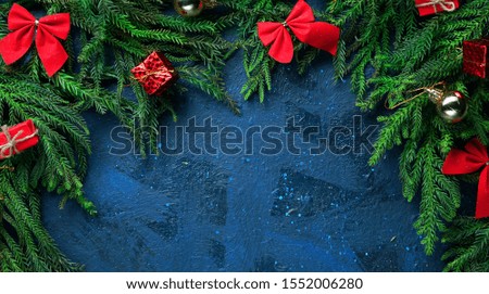 Christmas Tree Branches and Decoration. Dark Blue Background Empty Space