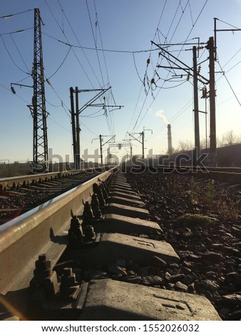 Railway tracks and electric lines in the industrial zone.