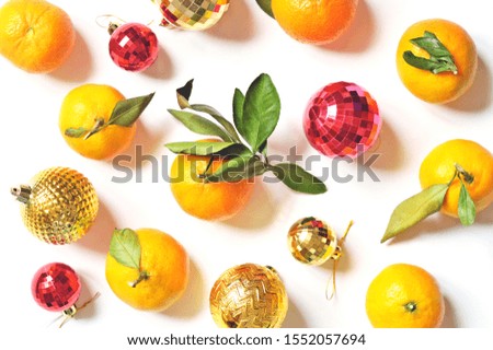 Beautiful winter holidays flat lay composition photography. Christmas decoration and mandarin orange fruits. Chinese New Year symbol