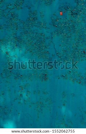 Crackled blue green paint on metal surface Abstract background