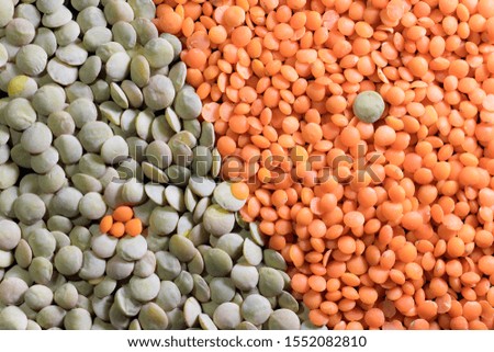 Detail of red lentil and green lentil grains diagonally bisected in Yin Yang style