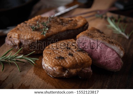 grilled duck breast meat with skillet