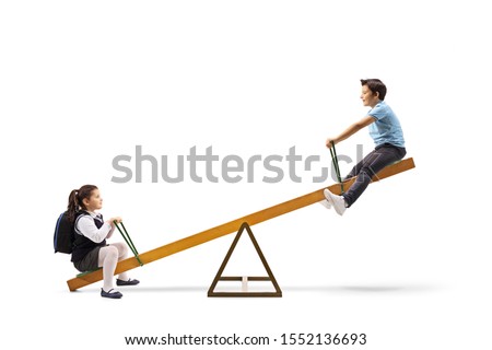 Happy kids playing on a seesaw isolated on white background Royalty-Free Stock Photo #1552136693