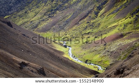 River along a V-shaped valley in Iceland Royalty-Free Stock Photo #1552148900