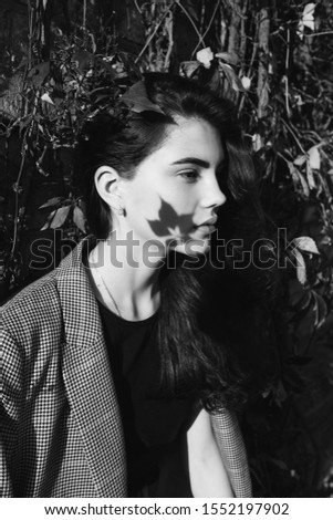 Close up portrait of young brunette stylish trendy girl outdoors in autumn park. Beauty, seasons, modeling, art, inspiration concept