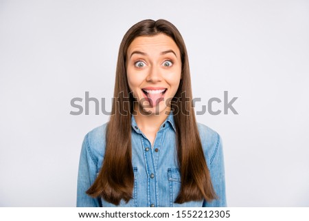 Portrait of excited funky funny feel rejoice on spring weekends show her tongue  make friends laugh wear casual style clothing isolated over white color background