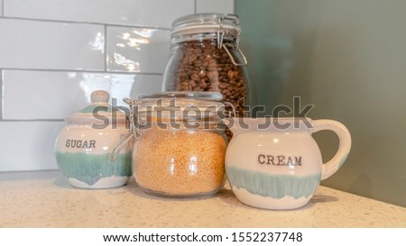 Panorama Coffee, cream and sugar containers on bench