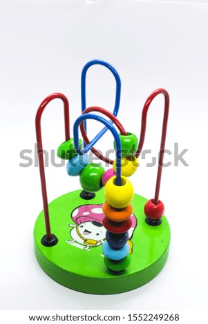 Educational kid's toy with beans on a line