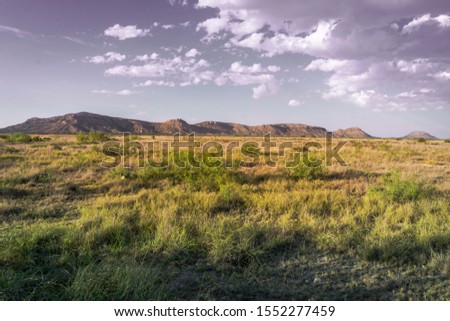 Beautifully rugged west Texas mountain landscapes with sun lit backdrops Royalty-Free Stock Photo #1552277459