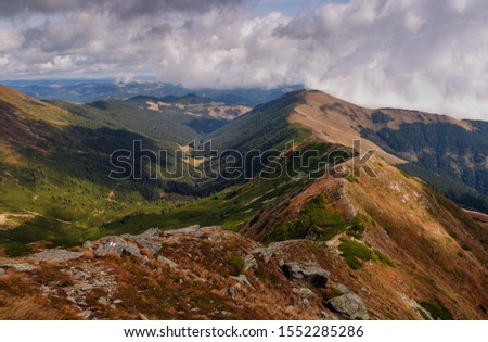 Rodna Mountains  - view from the approach to the Mt. Ineut towards the mountain trail to the Rotunda Pass, Eastern Carpathians, Romania, Europe, autumn time. Royalty-Free Stock Photo #1552285286