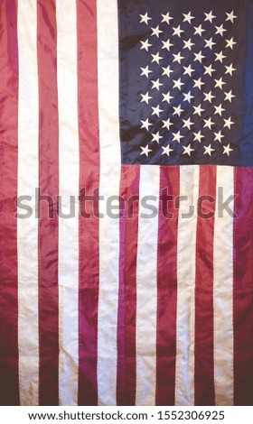 A vertical shot of the united states flag - great for background or a blog