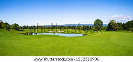 Panorama View of Golf Course with beautiful green field. Golf course with a rich green turf beautiful scenery.
