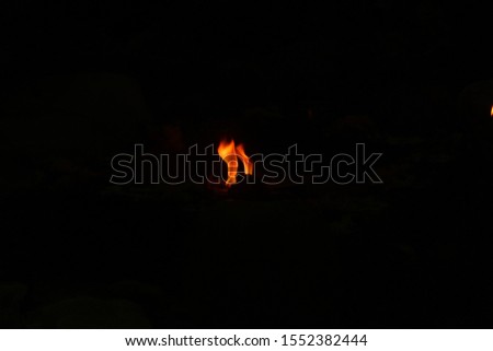 uncontrollable Fire and oil lamp fire flames on one single picture with orange / red / black and white color fire flame with black background.