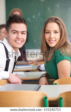 Two happy handsome students posing