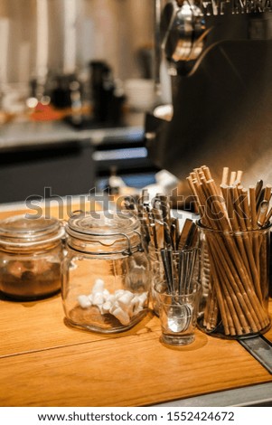 Coffee shop interior design with cups spoons and kitchen details