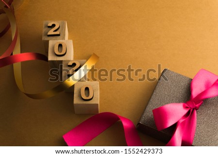 Happy New Year 2020. Symbol from number 2020 on brown background