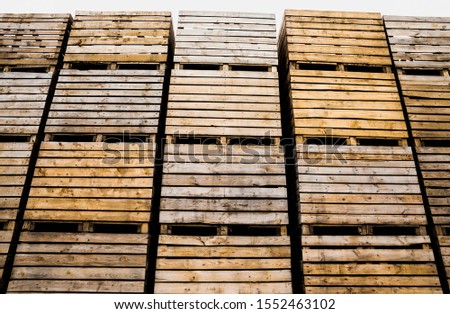 folded empty wooden boxes in warehouses, boxes are designed for harvesting fruits and vegetables