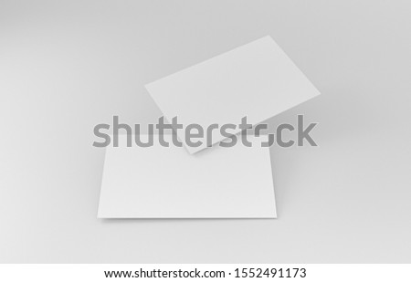 Two empty white business cards. Mockup for branding identity. Blank name card or poster on white background, studio shot. great for text & logo for design creative concept. 3D illustration