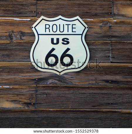 route 66 road sign on wooden planks