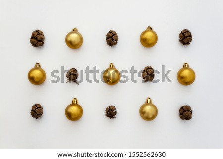 Creative Pattern Useful for Christmas and New Year Created Using Pine Cones and Decorative Christmas Balls