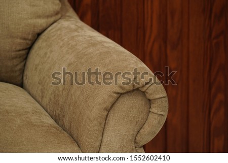 Yellow fabric sofa, close up detail. Interior furniture showroom photography