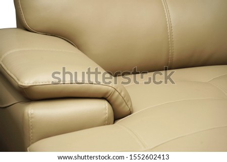 Yellow white leather sofa, close up detail. Furniture showroom photography
