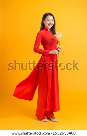 Beautiful woman with with lotus flower, Beautiful girl with Vietnam culture traditional, Life of Vietnamese Royalty-Free Stock Photo #1552633400