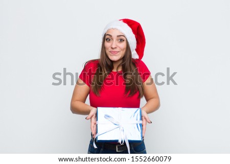 young pretty woman with santa hat. Christmas concept.