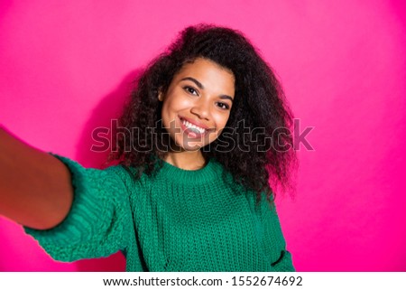 Close up photo of positive cheerful afro american girl blogger on autumn fall holidays vacation tour take selfie feel content wear stylish trendy jumper isolated over bright color background