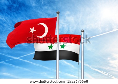 Turkey and Syria national flag waving against clouds blue sky. Side view of natural color of Turkish turk state and Syrian arab republic symbols isolated for design. Copy space template