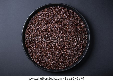 roasted coffee beans background black 