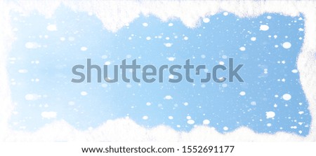 Frame of snowflakes and snow blue sky - winter background banner long