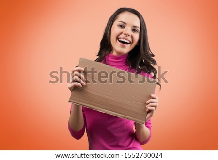 Happy Jobseeker with Hire Me Sign Royalty-Free Stock Photo #1552730024