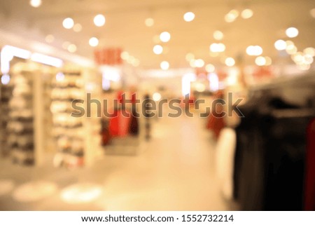 blurred abstract background of multicolored cotton clothing on the shelves of fashion.
