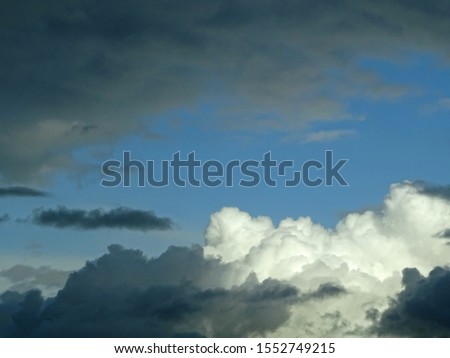Grey and white clouds in a blue sky