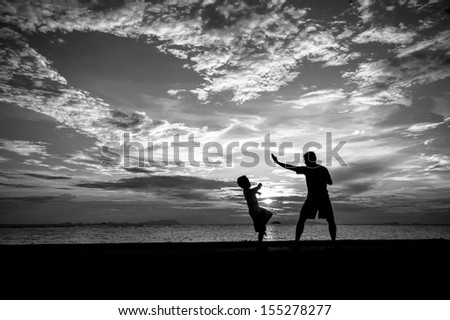 silhouette of family at dusk.
